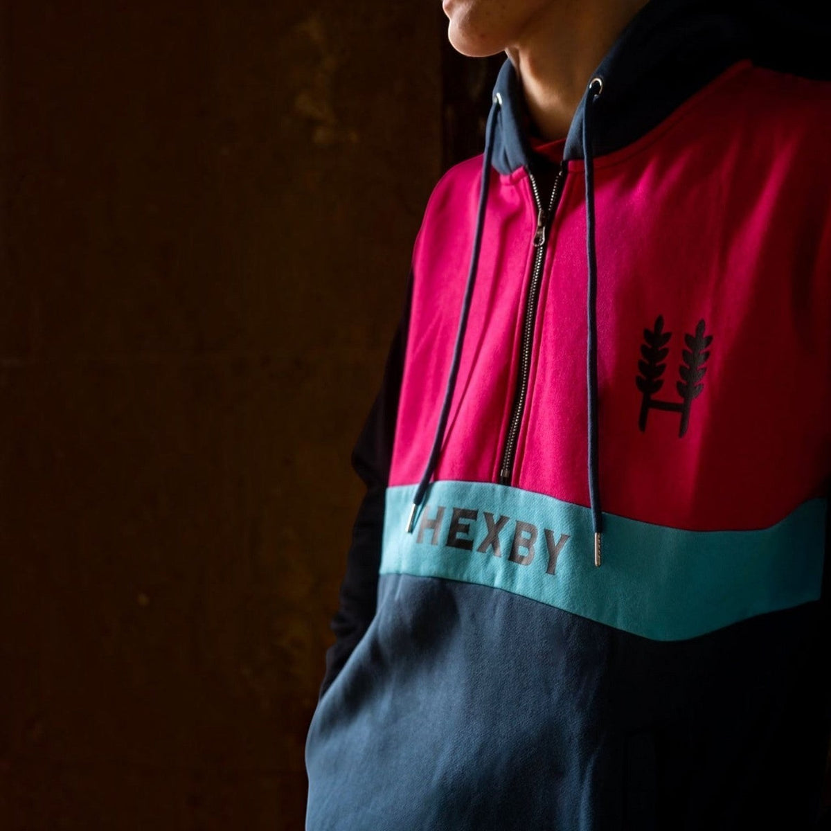 BATA LTD Hexby adult shearing hoodie in pink, teal, and navy blue with a front zip and logo detail.