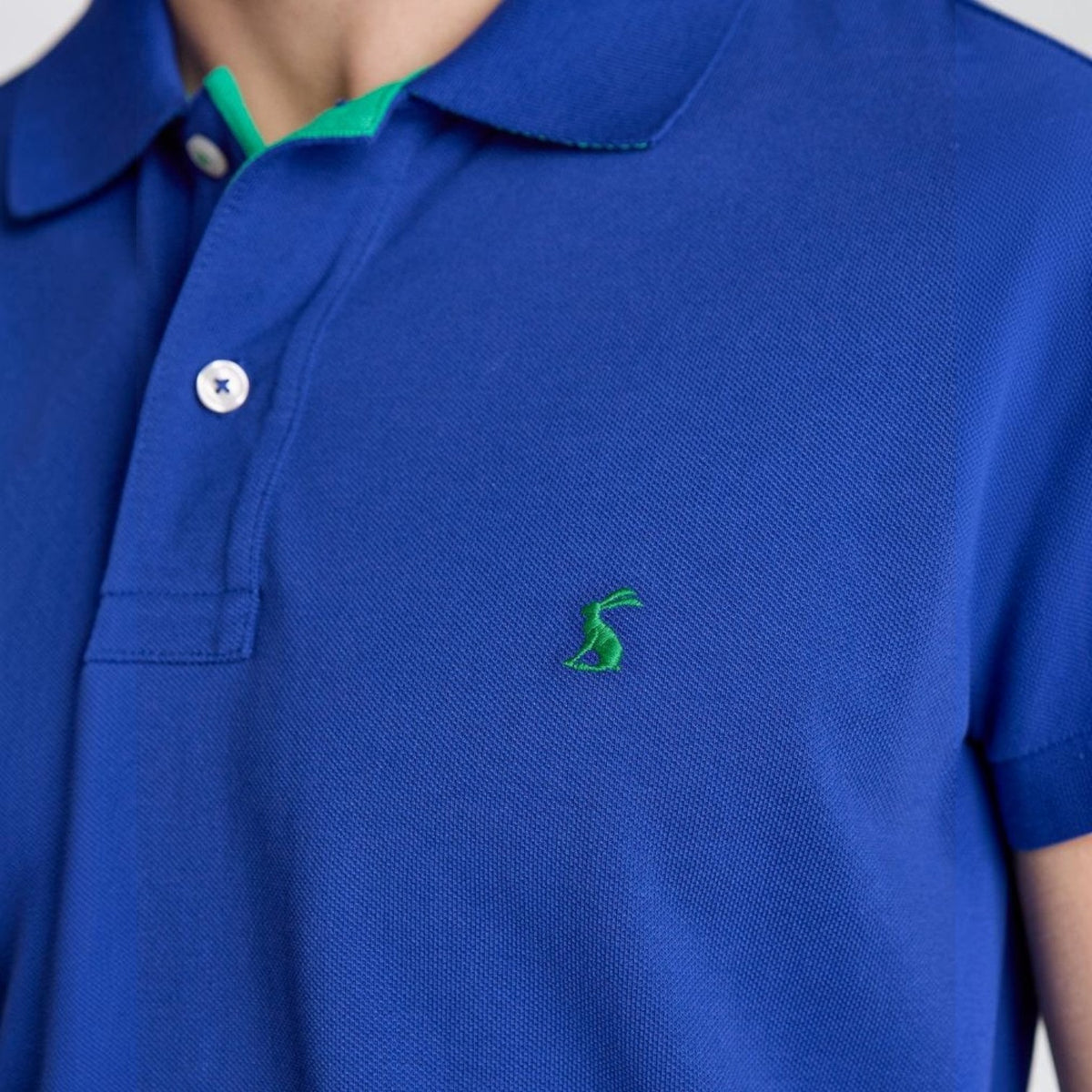 BATA LTD Joules Woody blue cotton pique polo shirt with green undercollar and embroidered hare logo on chest