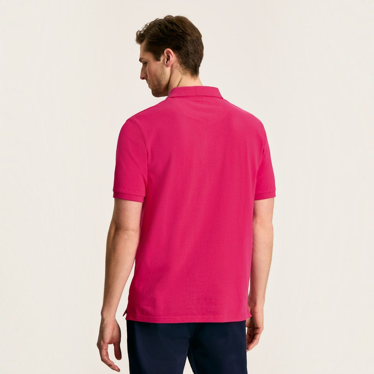 BATA LTD Joules Woody pink cotton pique polo shirt worn by a man, back view showing short sleeves and collar