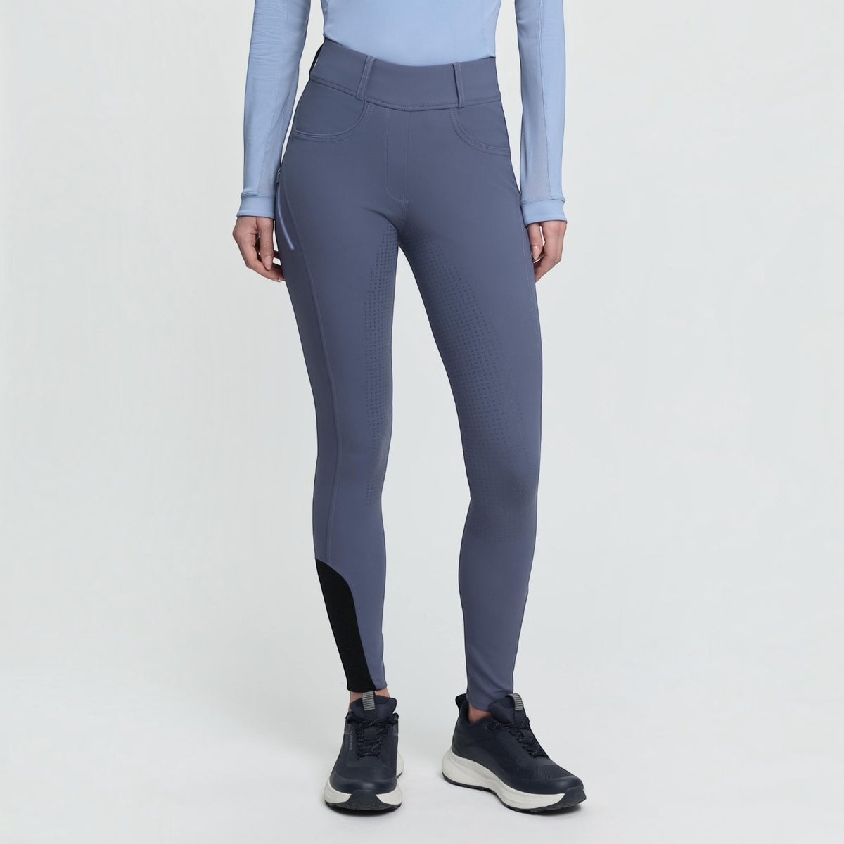 BATA LTD LeMieux Amy breggings in blue with silicone grip seat, phone pocket, and tapered fit for equestrian wear.