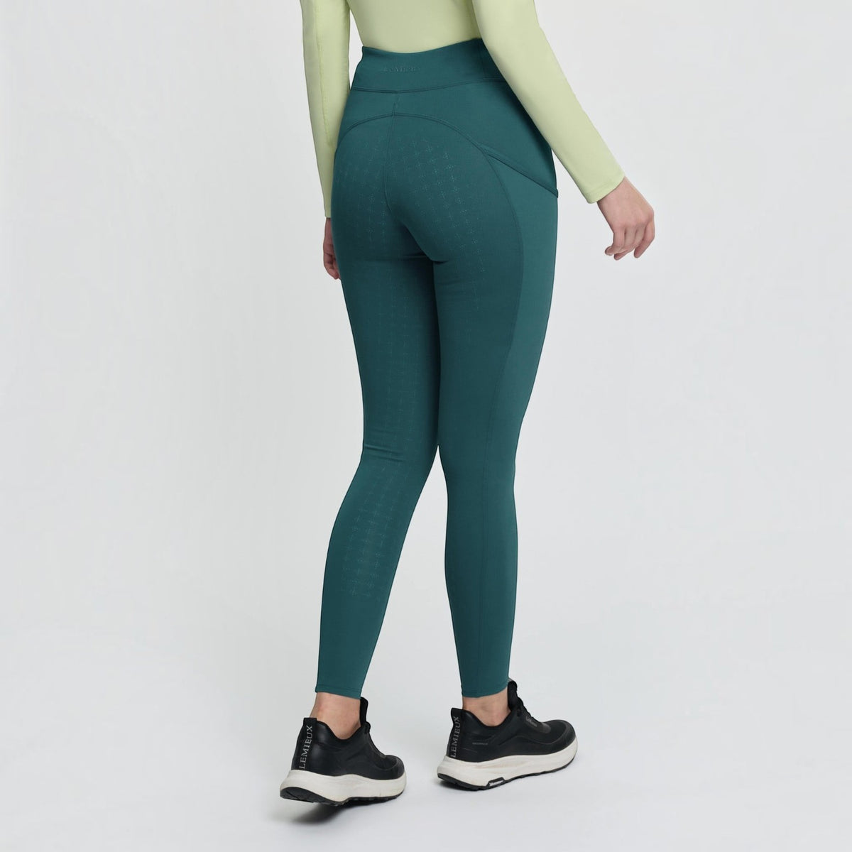 BATA LTD LeMieux Naomi pull-on breeches in teal with full silicone seat grip, shown from the back view.
